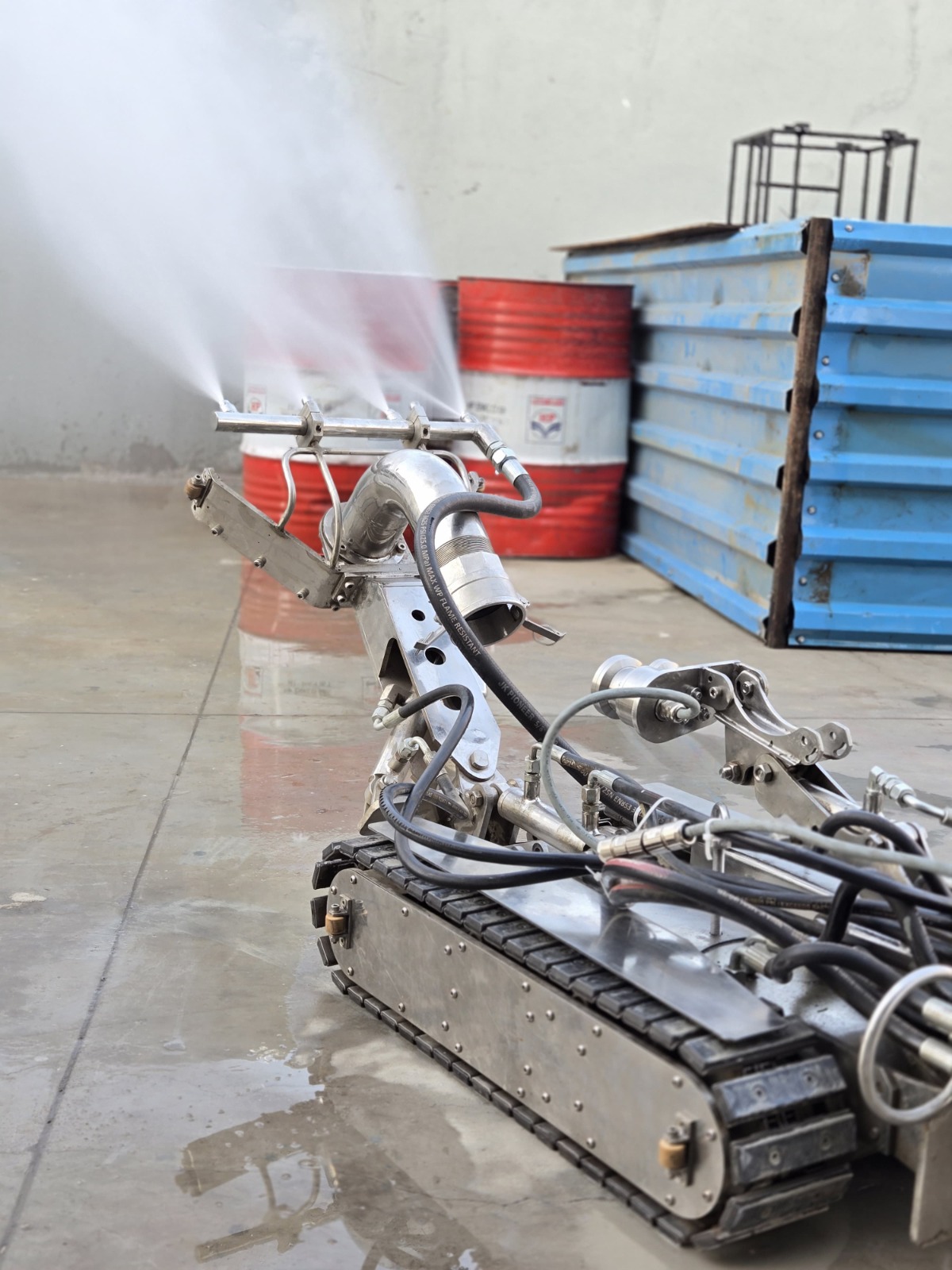 Robot jetting manifold and camera cluster in a test bay
